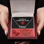 Custom Stainless Steel Name Necklace With Bible Verse Jewelry Message Card. Card features Bible verse John-3:16 - For God So Loved The World. Image of hands holding a white and black gift box is shown. The card in box has a black and red background.