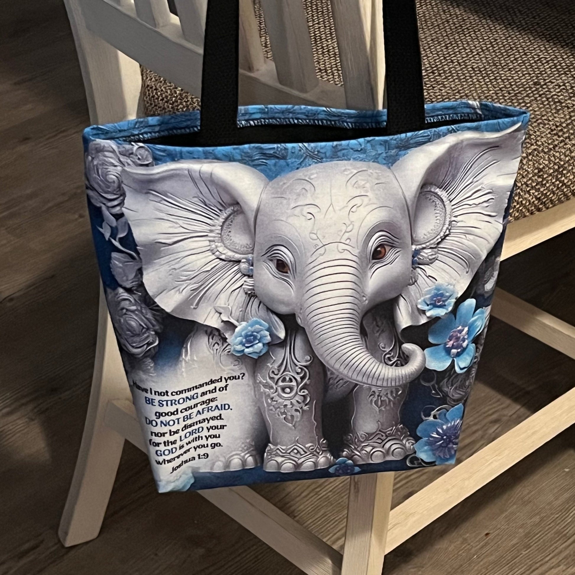 Gray 3D Elephant with 3D Flowers on a tote bag. Bible verse Joshua 1:19 is in the left corner of bag.