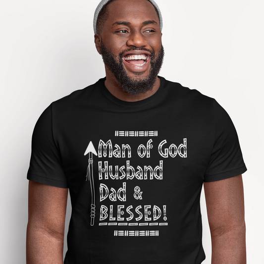 Man wearing a black Christian t-shirt with text on a white background that reads Man of God Husband Dad & Blessed!