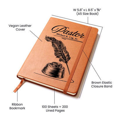 Vegan leather journal with feather and inkwell design on the cover. Features of the journal are labeled. Journal is on a white background. Personalization available for the pastor's name.