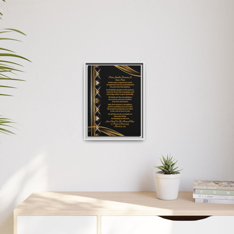 Pastor Appreciation Plaque canvas with decorative gold and silver design on black background with white frame hanging on a wall.