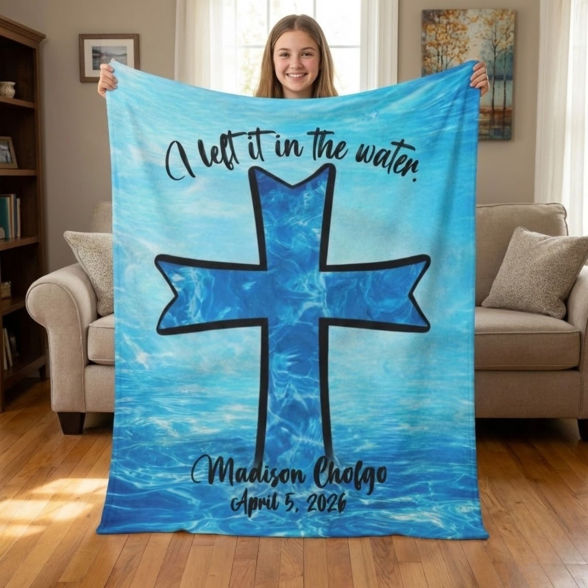 girl holding large personalized sherpa baptism blanket