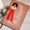 African American female dressed in red and white pants and shirt on front cover of a vegan leather writing journal. Quote on journal reads:  