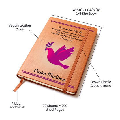 Vegan Leather Writing Journal for a female pastor.  The journal features on it's cover a fuchsia dove with a twig in it's beak and the Bible verse 2 Timothy 4:2. The words Preach The Word as well as the personalized name of the minister is in bold letters.