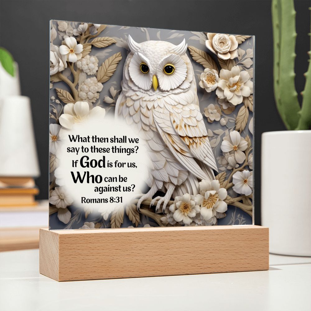 Acrylic Bible verse decorative plaque features a captivating image of a beautiful white owl along with Bible Verse Romans 8:31. The owl as well as the white, tan and gray flowers surrounding it appears to be in 3D.