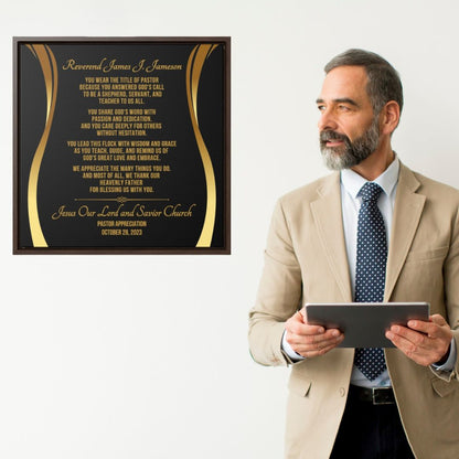 Man in a suit holding a tablet next to a framed plaque with text