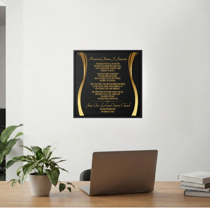 Pastor's appreciation plaque on a wall above a desk with a laptop and books.