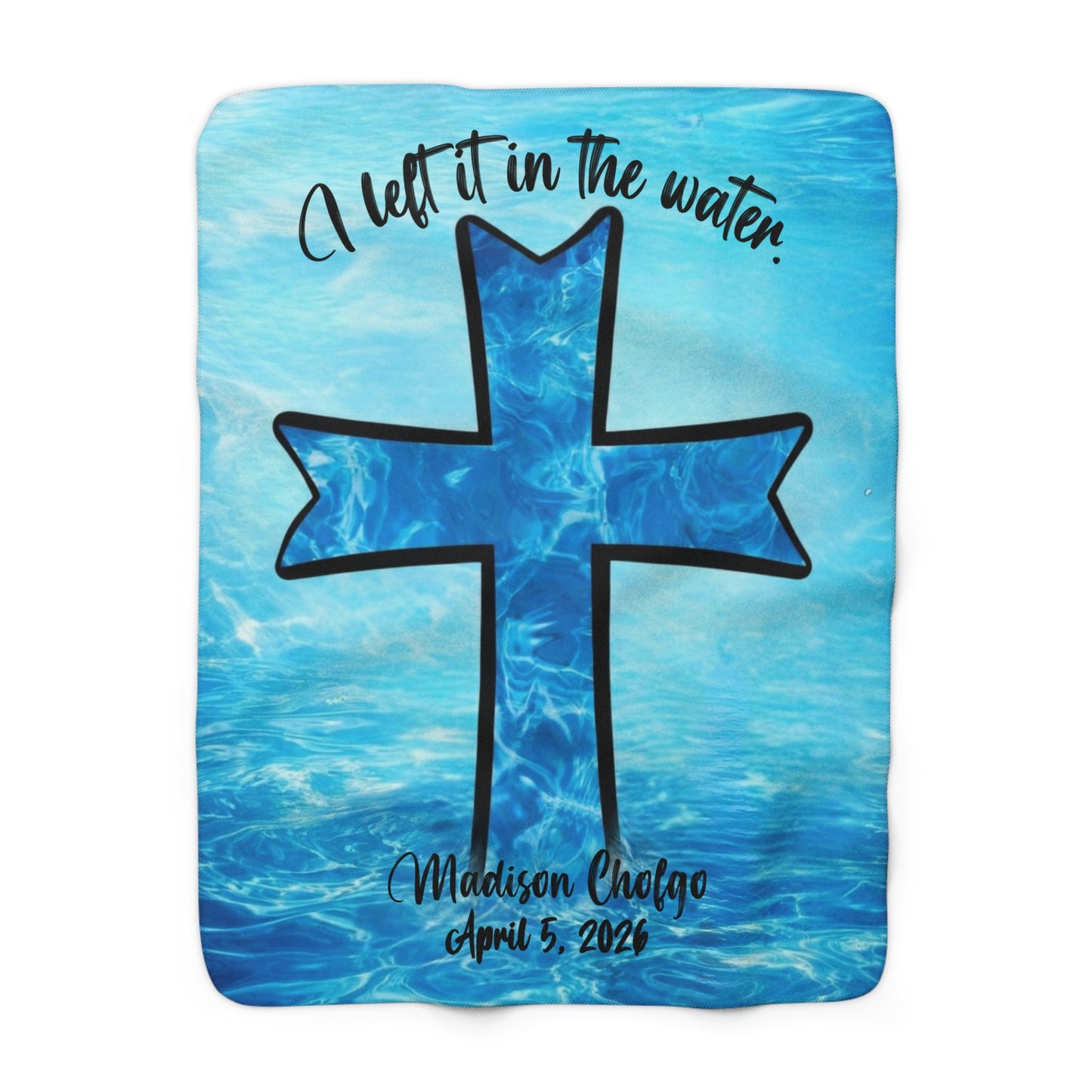 A personalized blue Sherpa baptism blanket that has an image of a cross in the water.