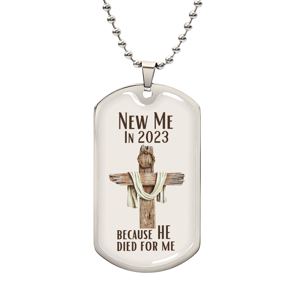 New Me In 2023 Because He Died For Me silver Dog Tag Necklace. Features a wooden cross with a crown of thorns on it with a cream background.