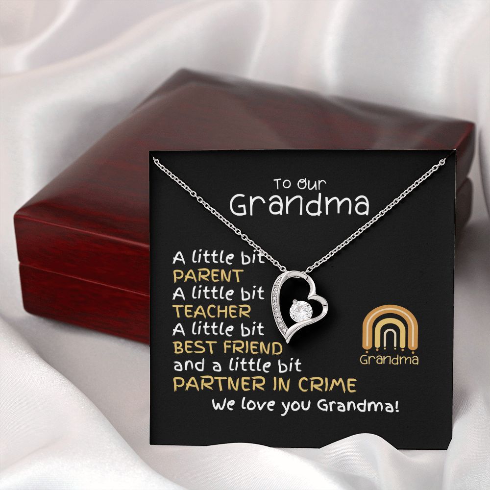 To our grandma from grandkids forever love cubic zirconia white gold filled heart necklace with message card and oreo gift box. Message card has children rainbow and cute message. Features mahogany gift box.
