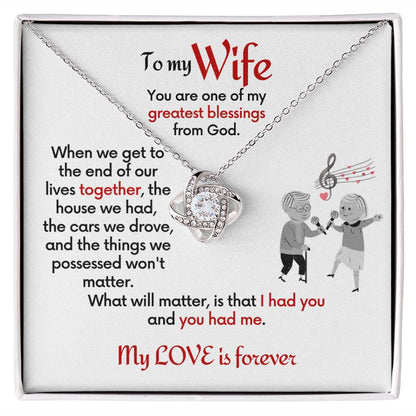 To Wife Love Knot necklace with jewelry message card. Card features special message to wife with an elderly man and woman singing together. Card is white background.